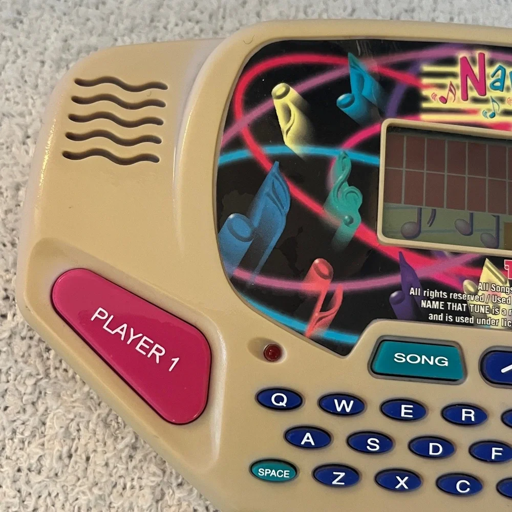 Name That Tune Handheld Game with country and western hits game Tiger toy